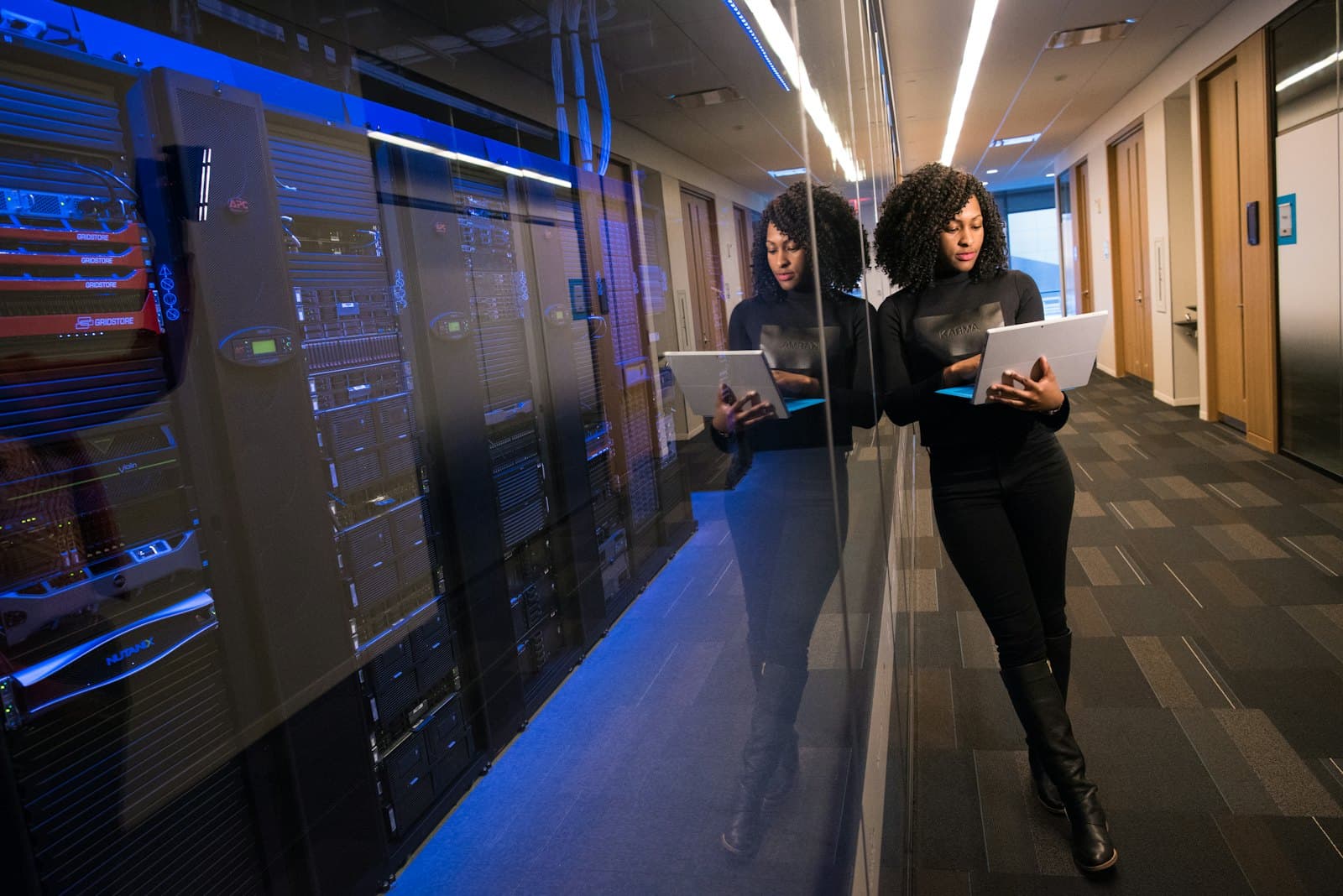 An engineer reviewing systems beside a data hall