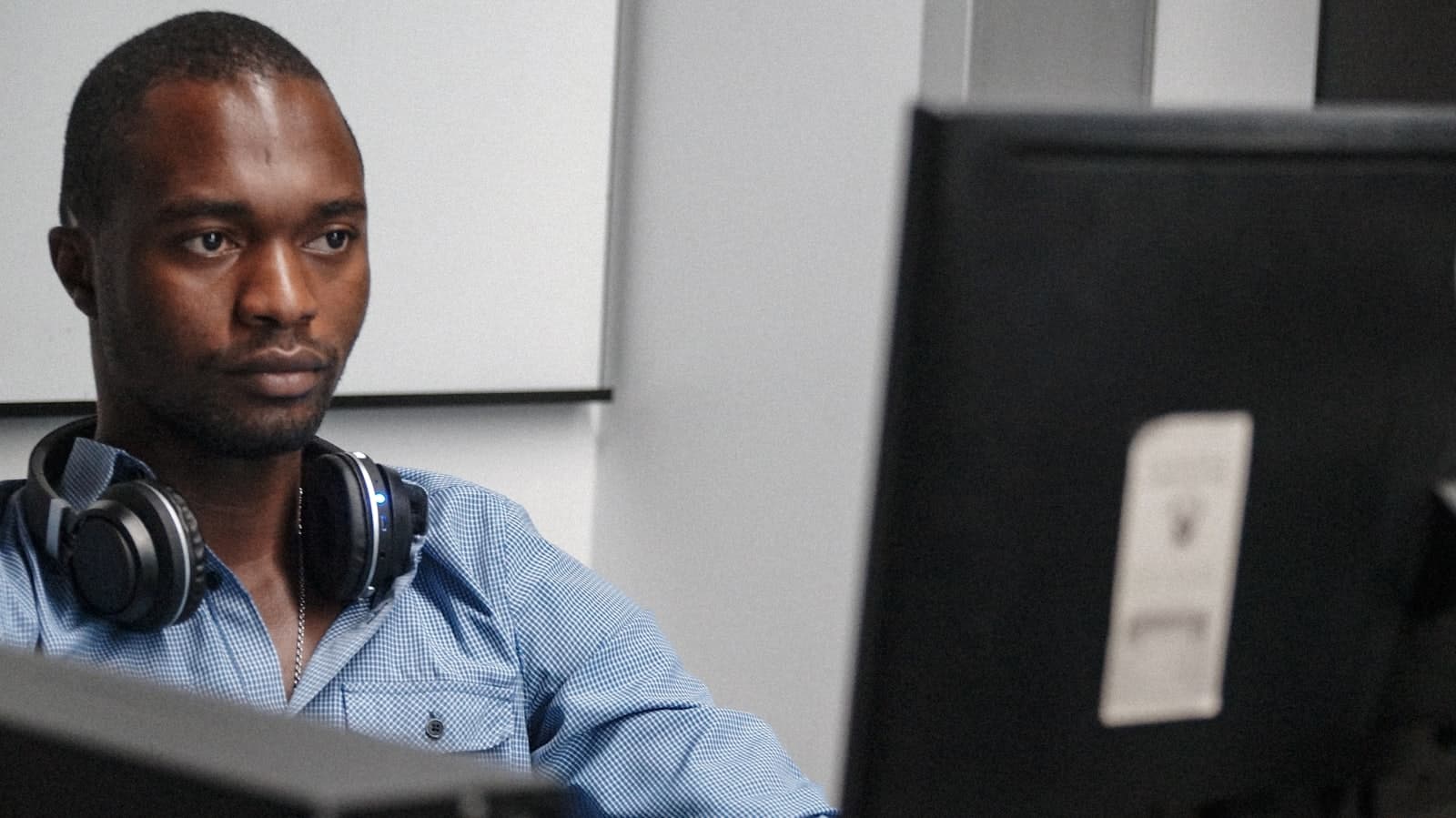 An engineer working at a managed desktop workstation
