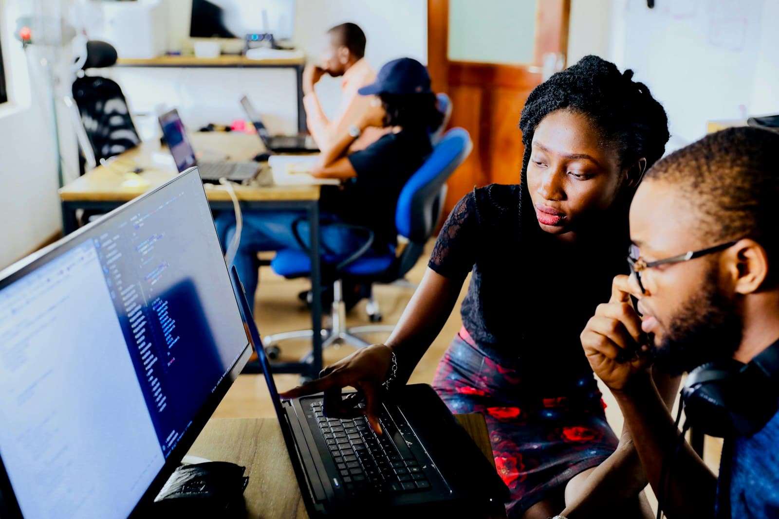 Engineers reviewing code together on screen